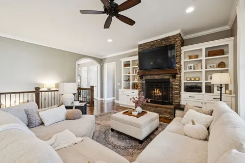 a kitchen with a sink cabinets and wooden floor