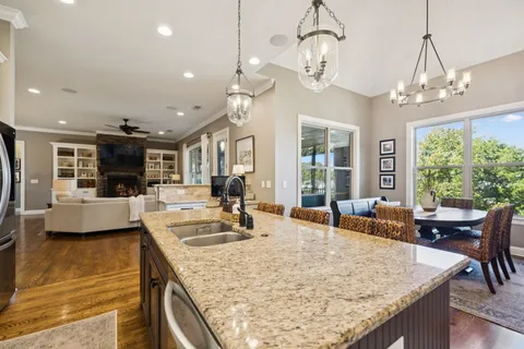 a view of a balcony with couch and wooden floor
