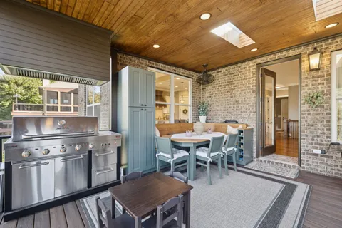 a bathroom with a granite countertop sink a toilet and a mirror
