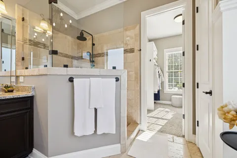 a living room with furniture and a ceiling fan