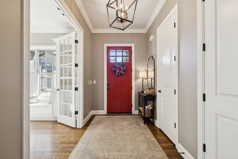 a view of a livingroom with furniture and a window