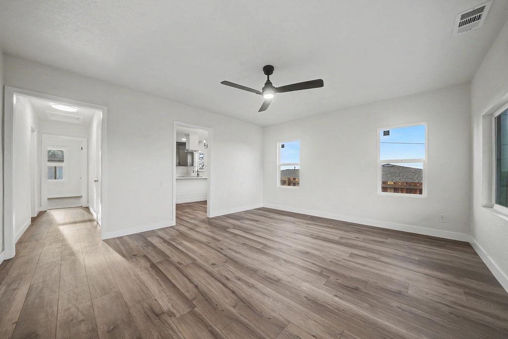 155 Foothill Drive Sutter Creek, CA 95685 - Photo 14 of 84 a view of empty room with wooden floor and ceiling fan