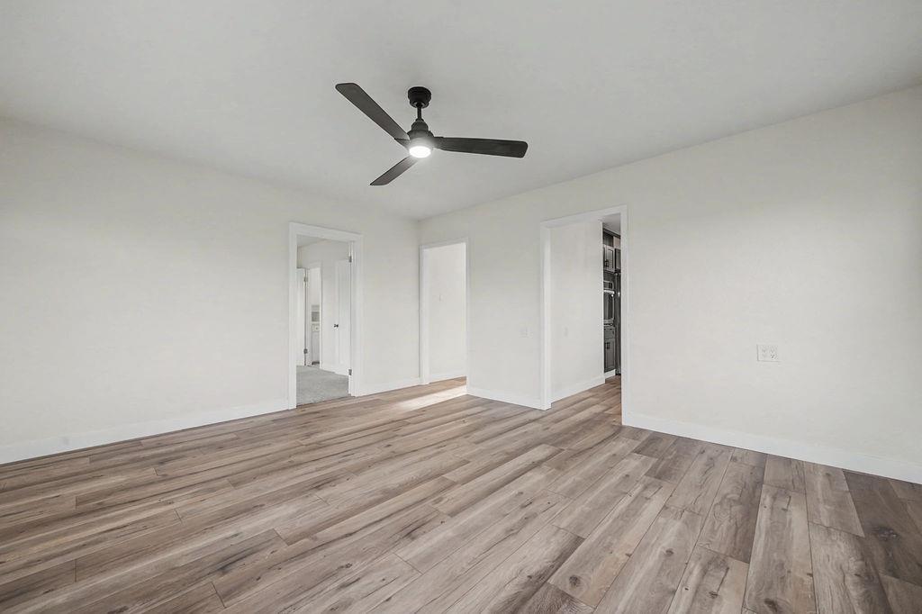 155 Foothill Drive Sutter Creek, CA 95685 - Photo 15 of 84 a view of empty room with wooden floor and ceiling fan