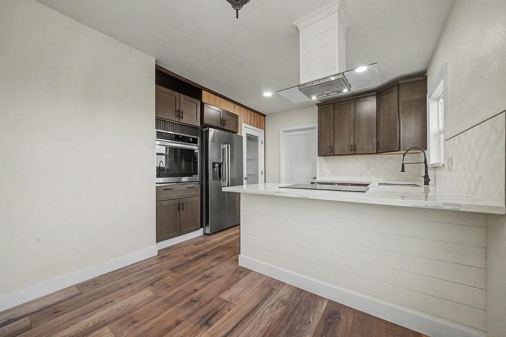 155 Foothill Drive Sutter Creek, CA 95685 - Photo 18 of 84 a kitchen with stainless steel appliances a refrigerator and a sink