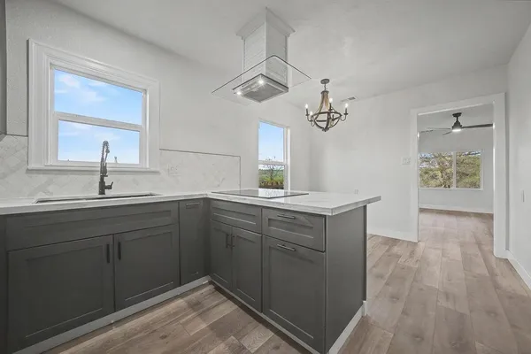 a spacious bathroom with a double vanity sink a mirror and shower