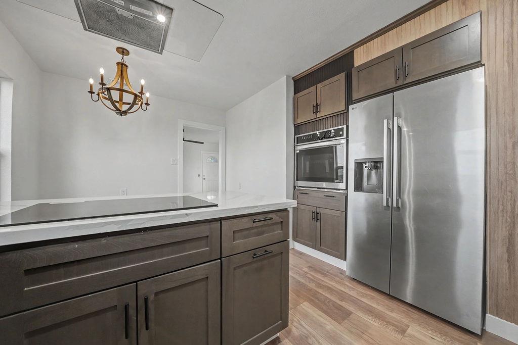 155 Foothill Drive Sutter Creek, CA 95685 - Photo 23 of 84 a kitchen with a refrigerator and a sink