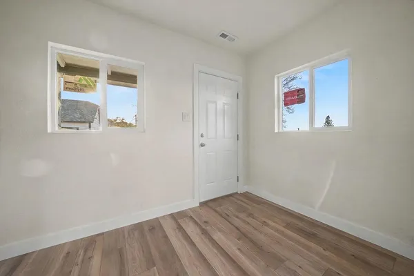 a front view of a house with a garden