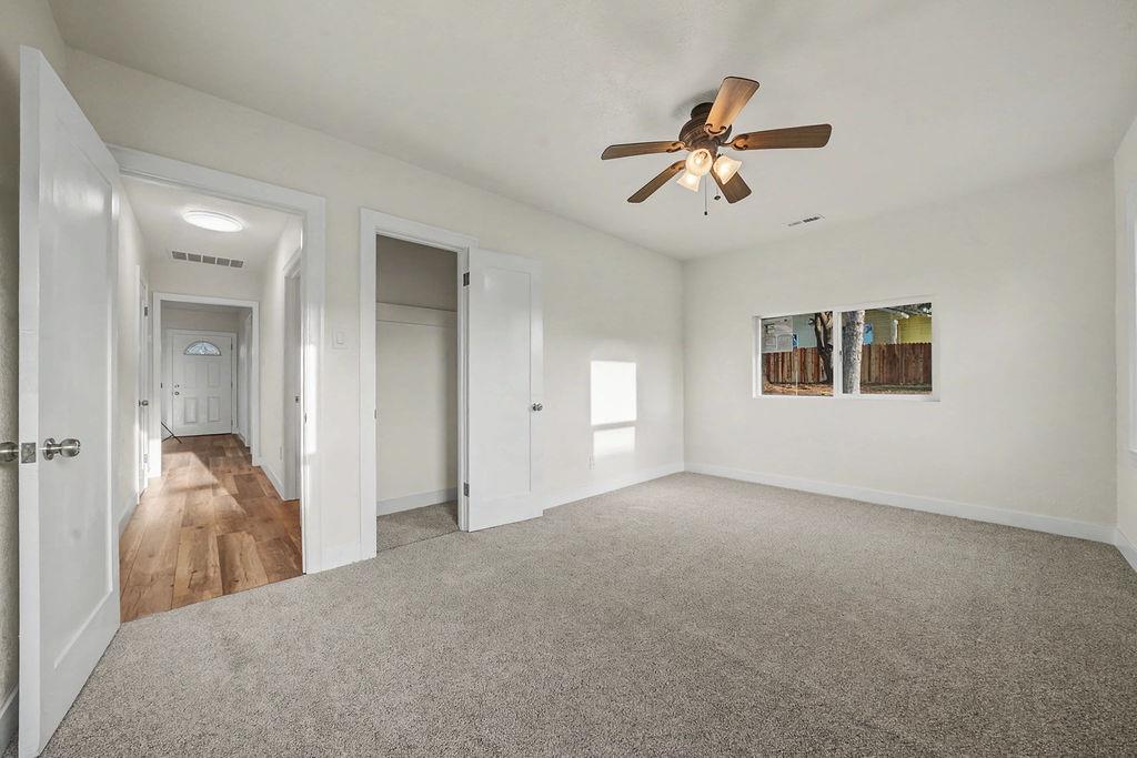 155 Foothill Drive Sutter Creek, CA 95685 - Photo 26 of 84 a view of a livingroom with a ceiling fan and windows