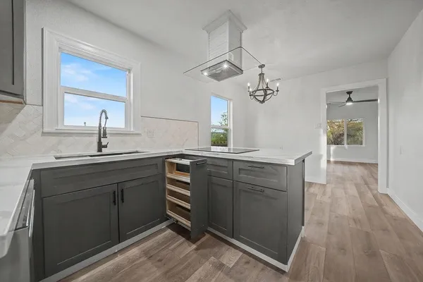 a front view of house with yard and trees