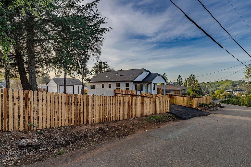 155 Foothill Drive Sutter Creek, CA 95685 - Photo 34 of 84 a front view of a house with a garden