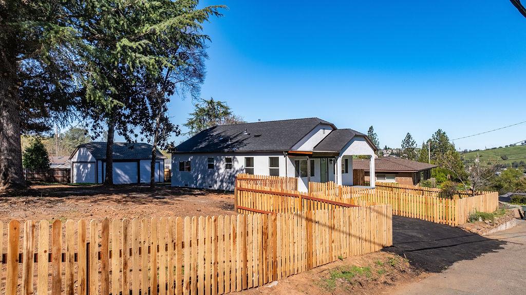 155 Foothill Drive Sutter Creek, CA 95685 - Photo 71 of 84 a view of a white house with a large tree