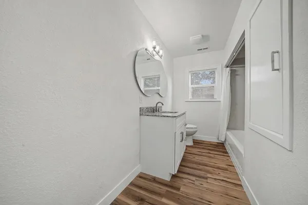a bathroom with a sink and mirror