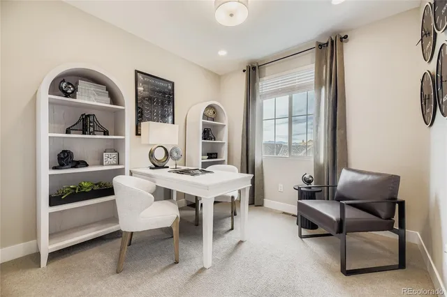 a view of a livingroom with furniture and window