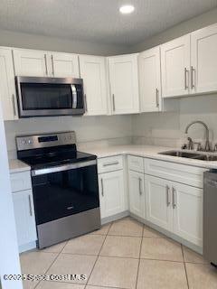 4612 Kaileen Circle Northeast Palm Bay, FL 32905 - Photo 6 of 8 a kitchen with cabinets stainless steel appliances and a sink