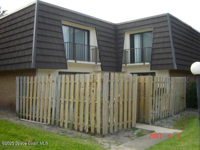 4612 Kaileen Circle Northeast Palm Bay, FL 32905 - Photo 8 of 8 a front view of a house with a garden