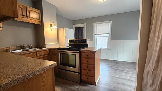 a kitchen with a stove and a microwave
