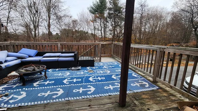 a view of a deck with two chairs and a table
