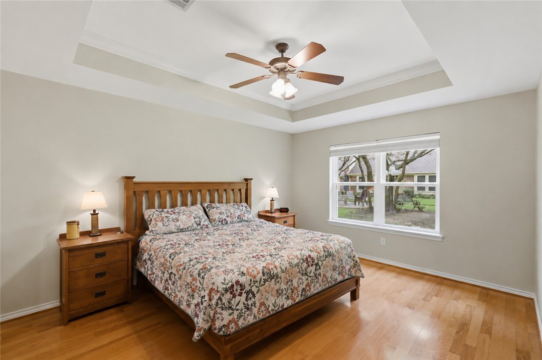 1520 Bennett Street Bryan, TX 77802 - Photo 14 of 24 a bedroom with a large bed and a window