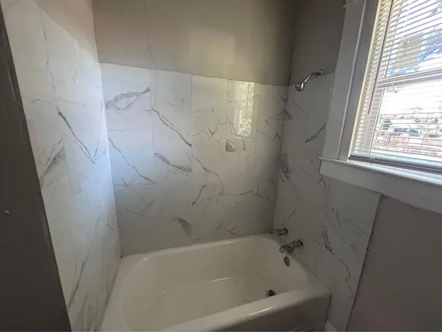 a bathroom with a bathtub