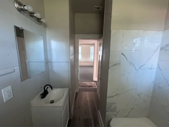 a bathroom with a toilet sink and bathtub