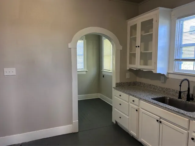 a view of a bathroom with a sink and mirror