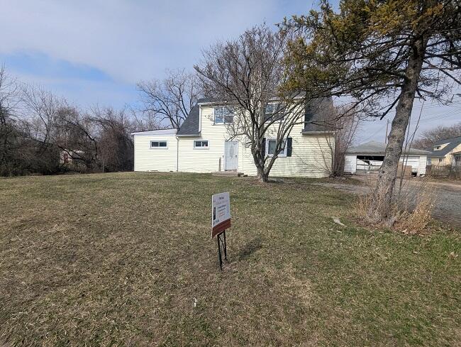 New front photo with sign