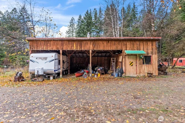 a view of a house with a patio and a car parked