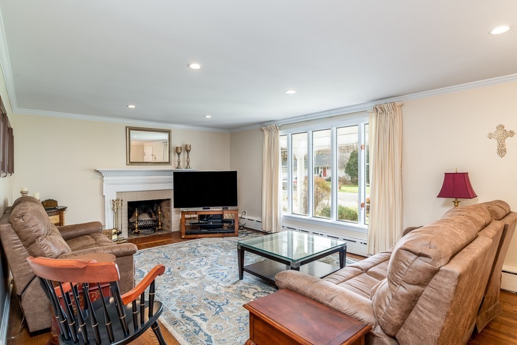 31 Whitmun Road Longmeadow, MA 01106 - Photo 14 of 25 a living room with furniture a flat screen tv and a fireplace
