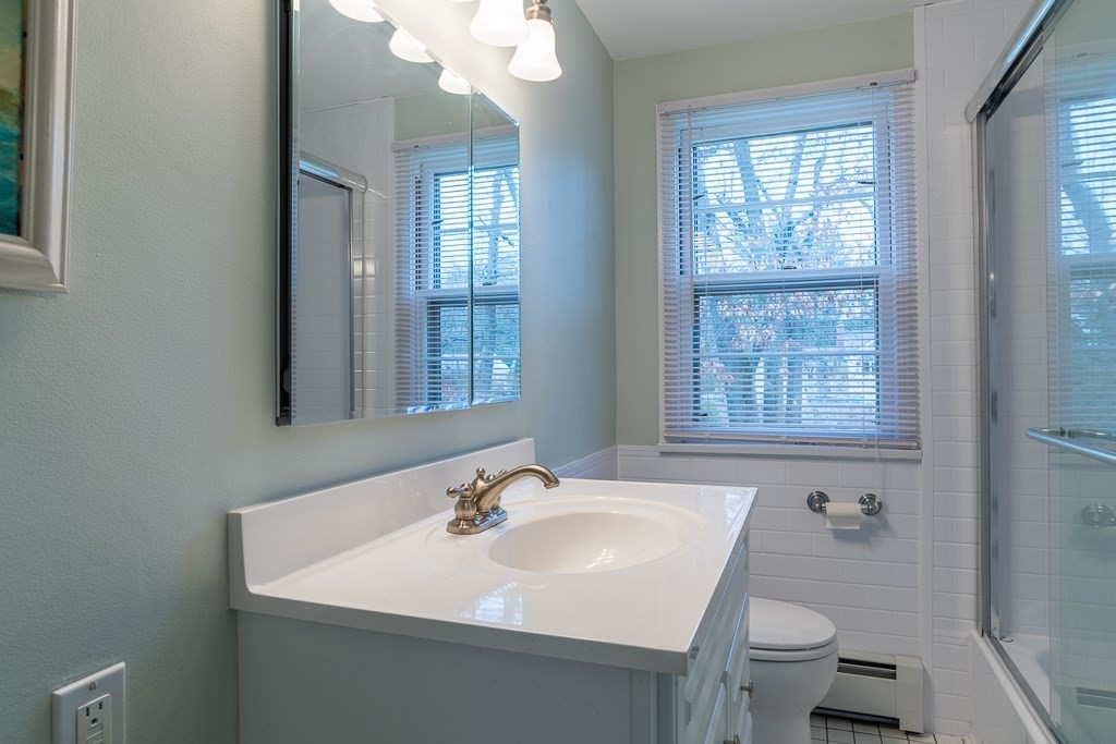 31 Whitmun Road Longmeadow, MA 01106 - Photo 23 of 25 a bathroom with a sink toilet and a mirror