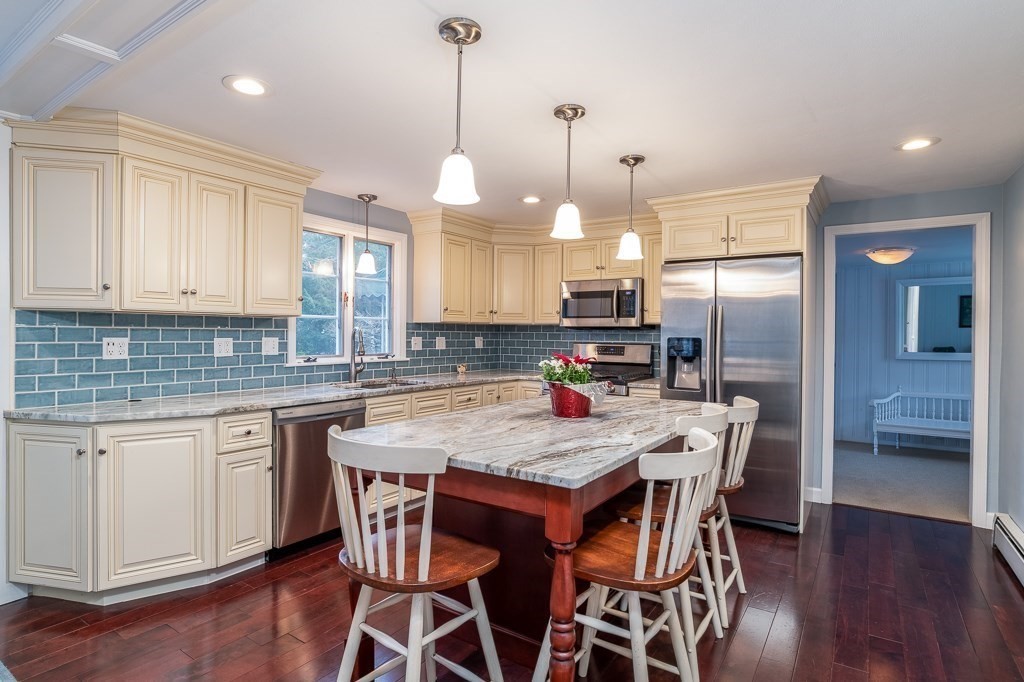 31 Whitmun Road Longmeadow, MA 01106 - Photo 10 of 25 a kitchen with stainless steel appliances granite countertop a kitchen island hardwood floor and a sink