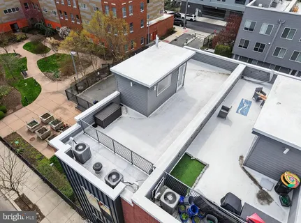 an aerial view of a house with roof deck