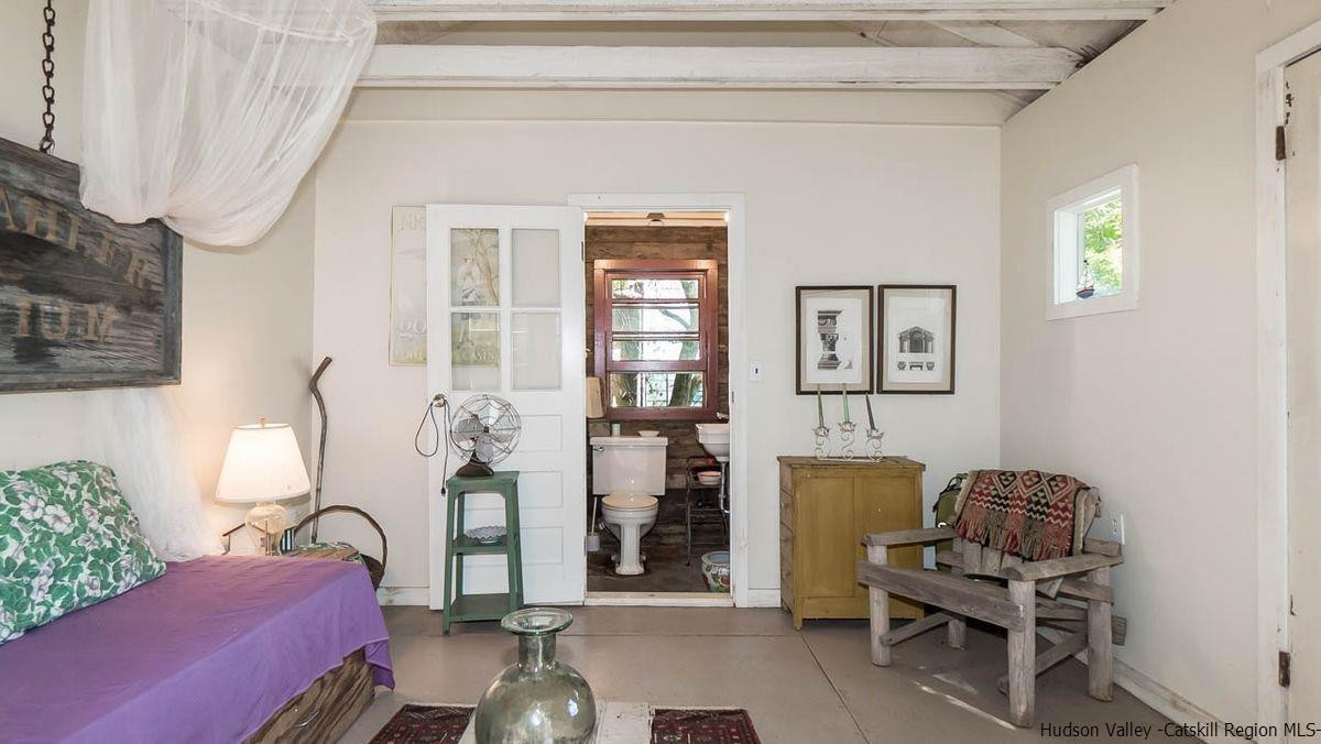 286 Rochester Center Road Kerhonkson, NY 12446 - Photo 18 of 34 a living room with furniture and wooden floor
