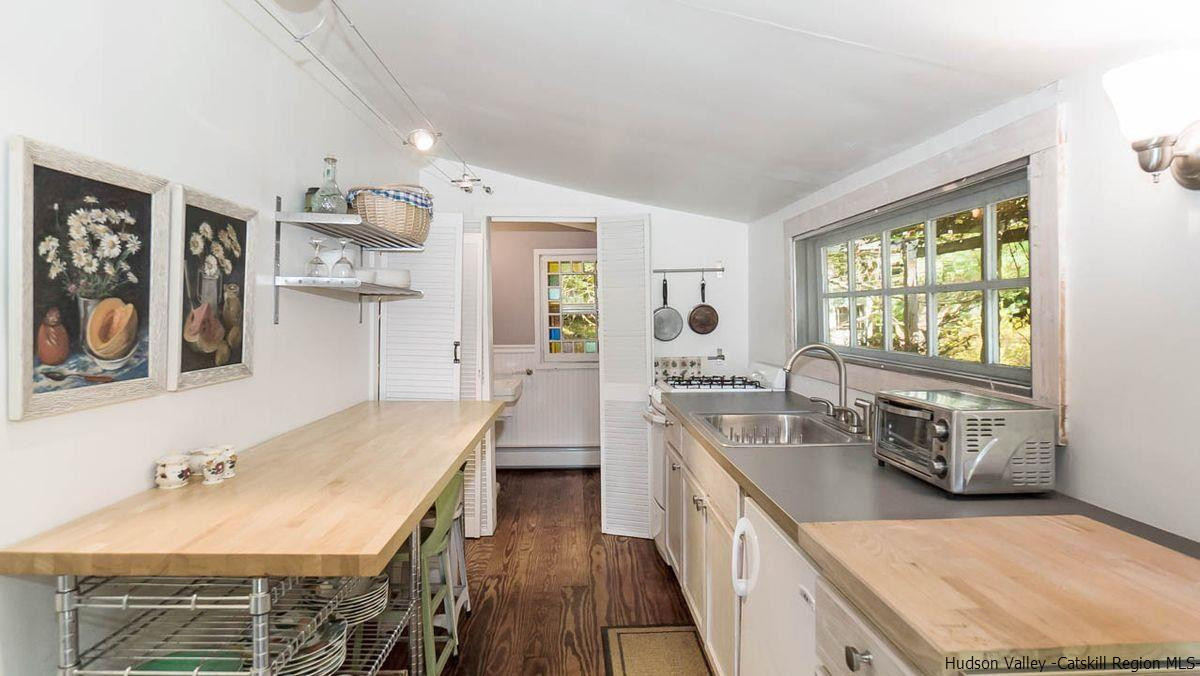286 Rochester Center Road Kerhonkson, NY 12446 - Photo 24 of 34 a kitchen with a sink stove and refrigerator