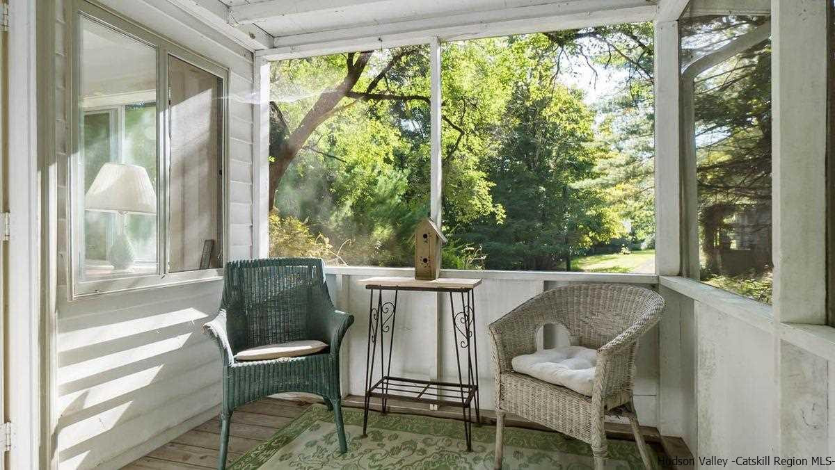 286 Rochester Center Road Kerhonkson, NY 12446 - Photo 28 of 34 a roof deck with table and chairs and wooden floor