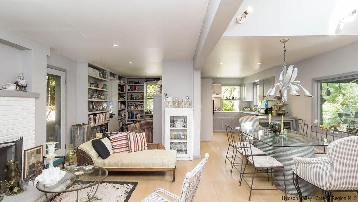286 Rochester Center Road Kerhonkson, NY 12446 - Photo 4 of 34 a living room with furniture and a book shelf