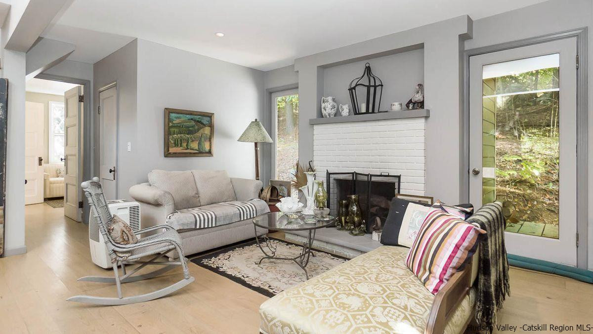 286 Rochester Center Road Kerhonkson, NY 12446 - Photo 6 of 34 a living room with furniture and a fireplace