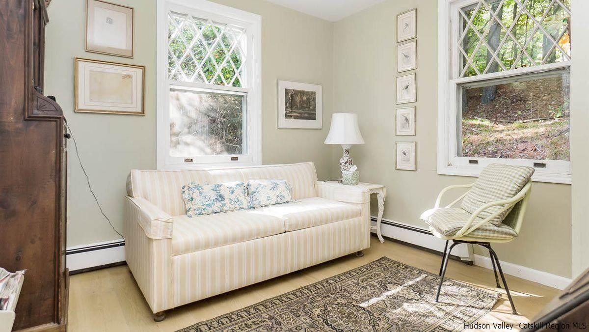 286 Rochester Center Road Kerhonkson, NY 12446 - Photo 9 of 34 a living room with furniture and a window