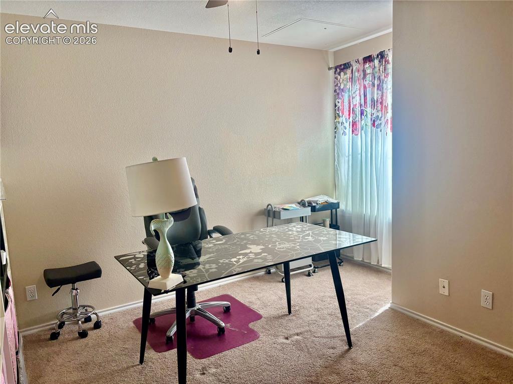 3748 Riviera Grove, Unit 203 Colorado Springs, CO 80922 - Photo 16 of 26 a view of a workspace with furniture