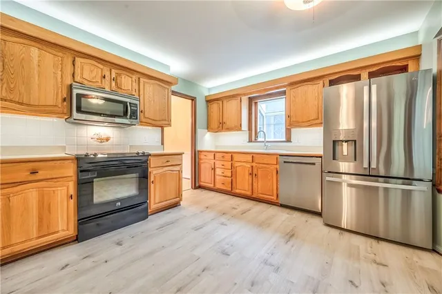 $395,000 | 9712 Craig Drive, Overland Park, KS 66212