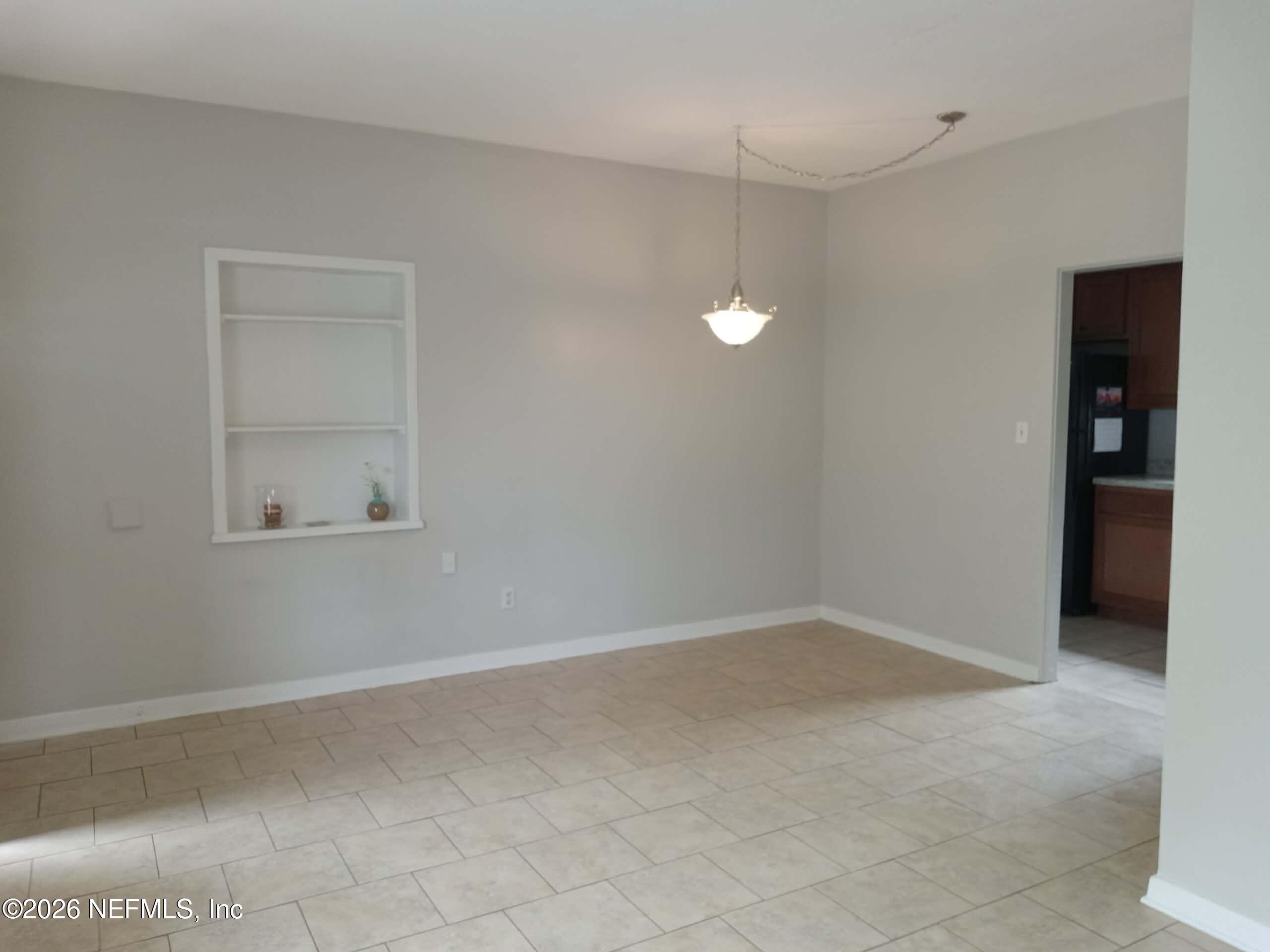 5527 Graywood Road Jacksonville, FL 32207 - Photo 3 of 12 an empty room with closet
