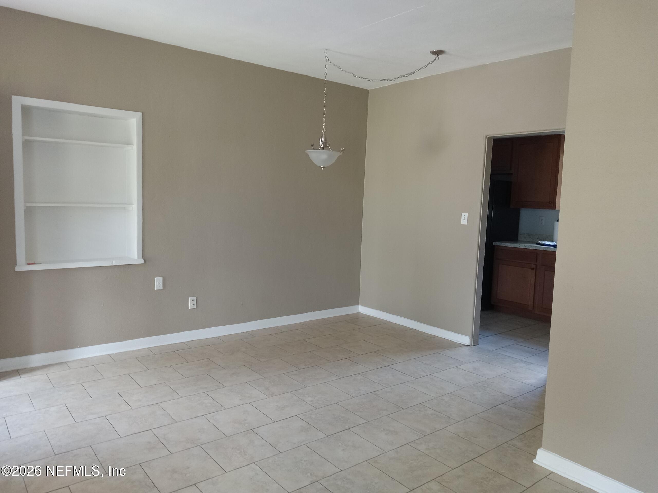 5527 Graywood Road Jacksonville, FL 32207 - Photo 3 of 12 an empty room with closet