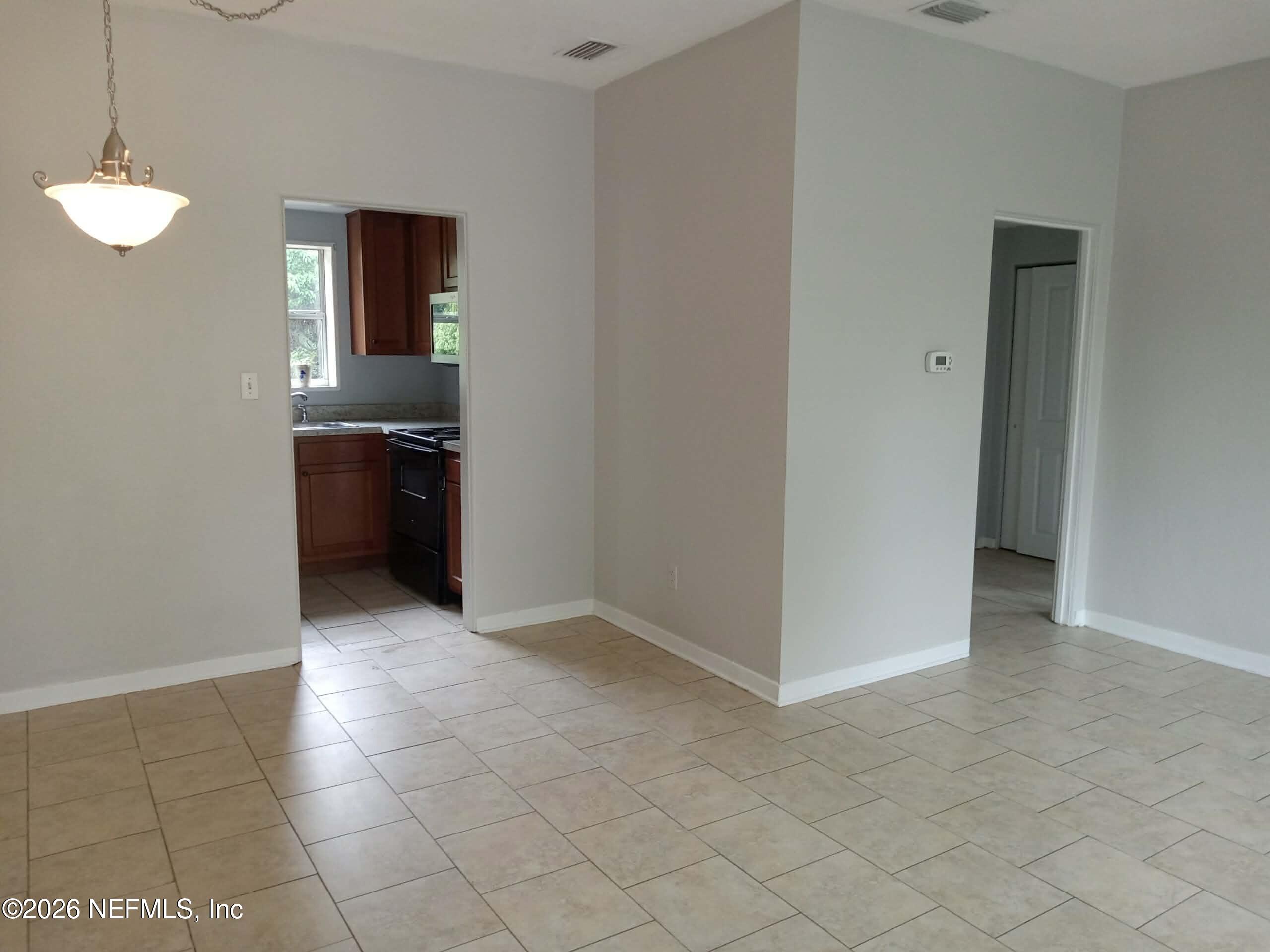 5527 Graywood Road Jacksonville, FL 32207 - Photo 4 of 12 a view of a kitchen with a sink and dishwasher kitchen appliances
