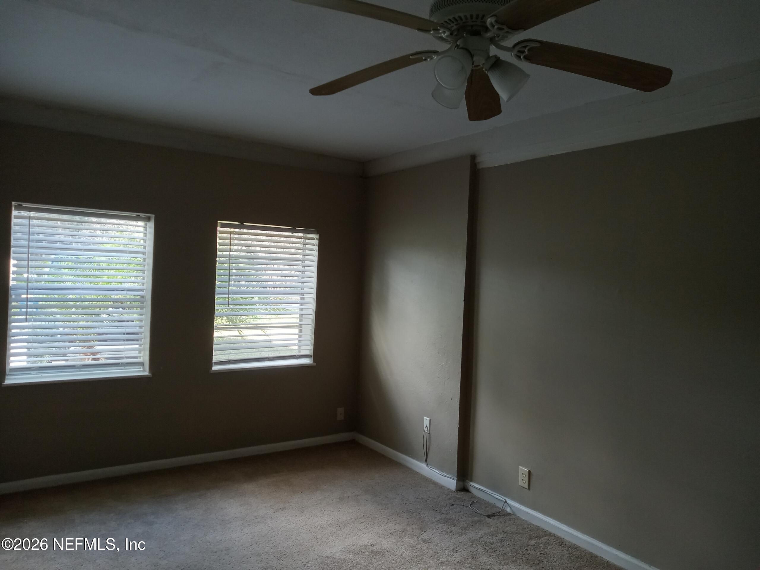 5527 Graywood Road Jacksonville, FL 32207 - Photo 9 of 12 a view of an empty room with a window
