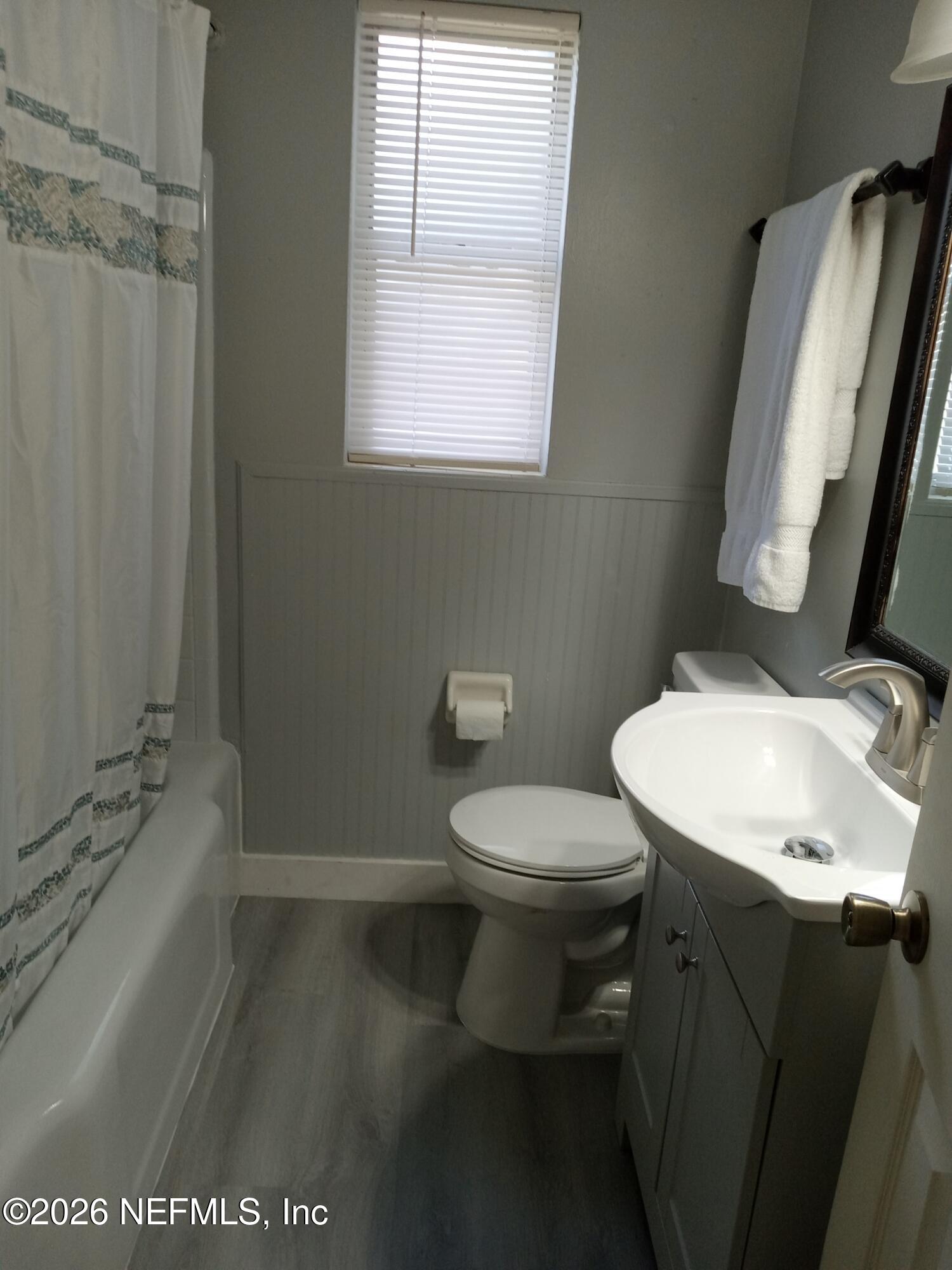 5527 Graywood Road Jacksonville, FL 32207 - Photo 10 of 12 a white toilet sitting next to a bathroom sink