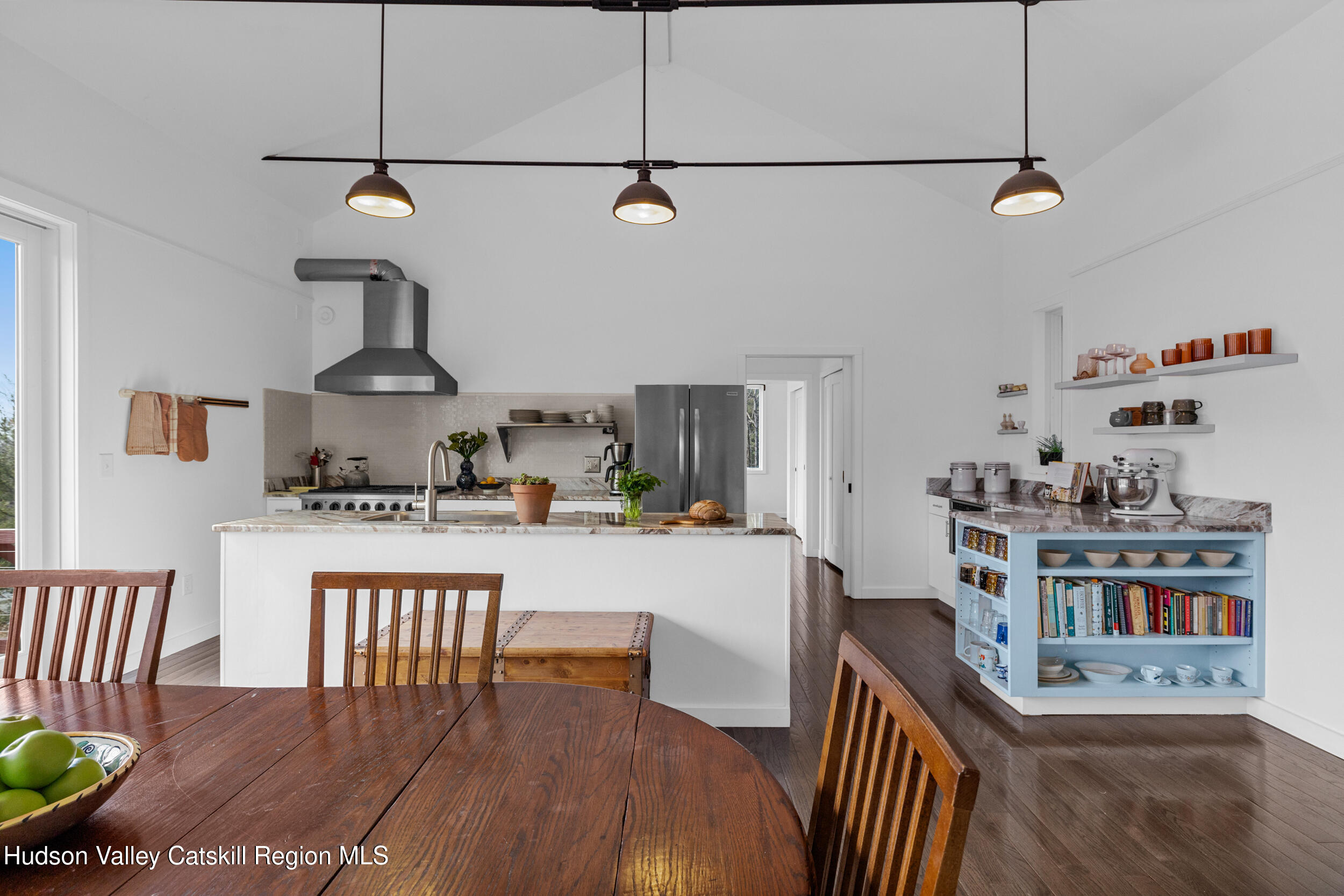 184 Haver Road Olivebridge, NY 12461 - Photo 14 of 31 a kitchen with stainless steel appliances granite countertop a stove a refrigerator a dining table and chairs with wooden floor