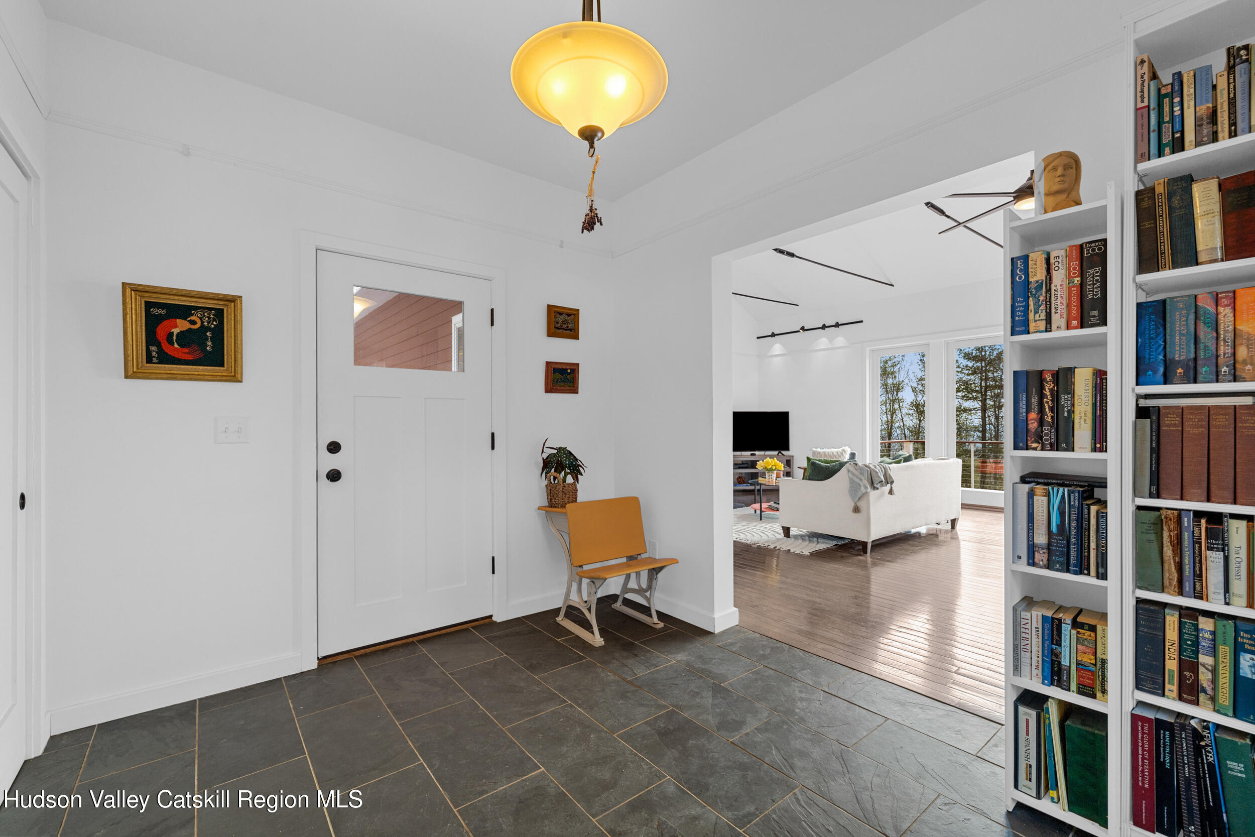 184 Haver Road Olivebridge, NY 12461 - Photo 20 of 31 a living room with furniture and a book shelf