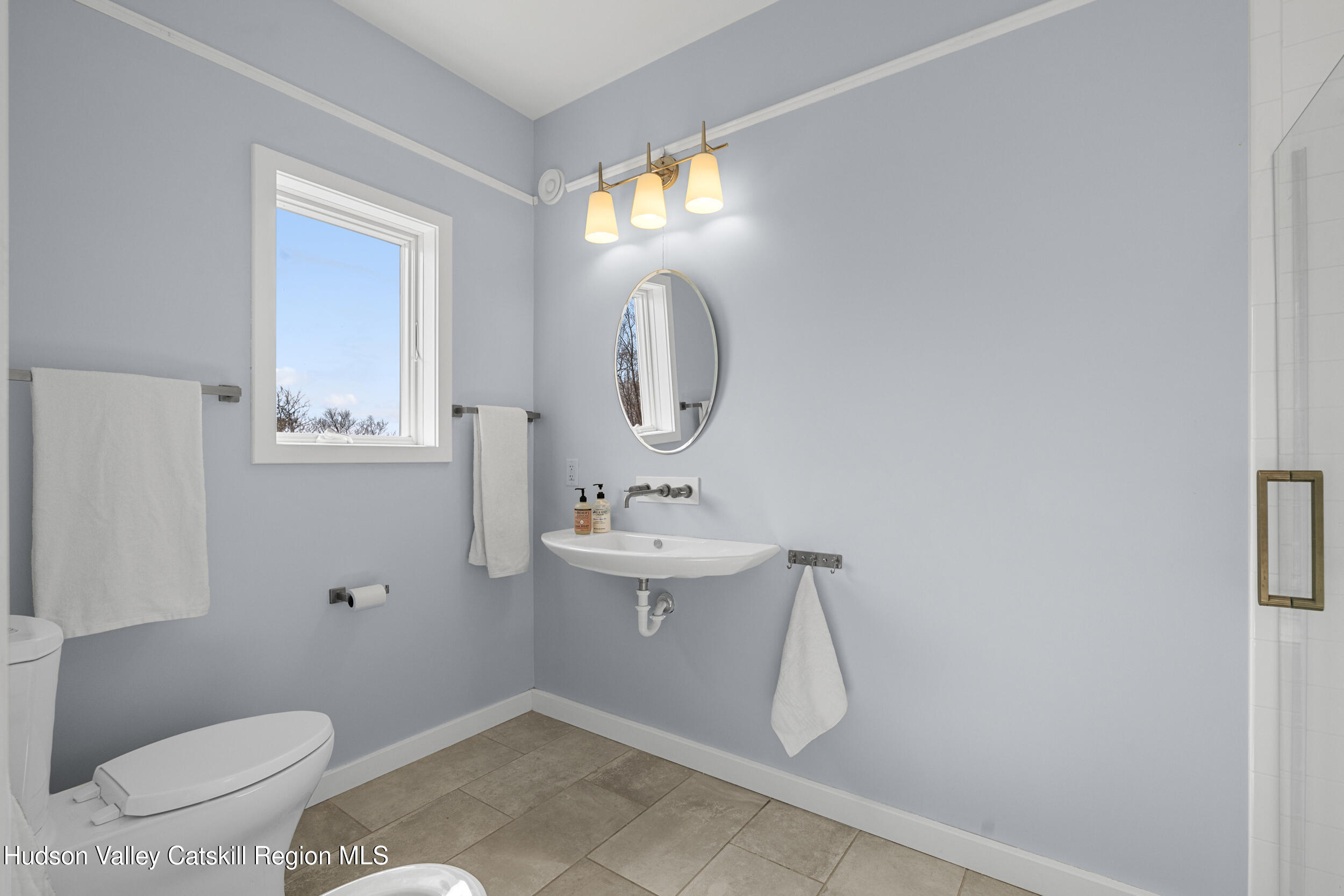 184 Haver Road Olivebridge, NY 12461 - Photo 10 of 31 a bathroom with a toilet sink and mirror