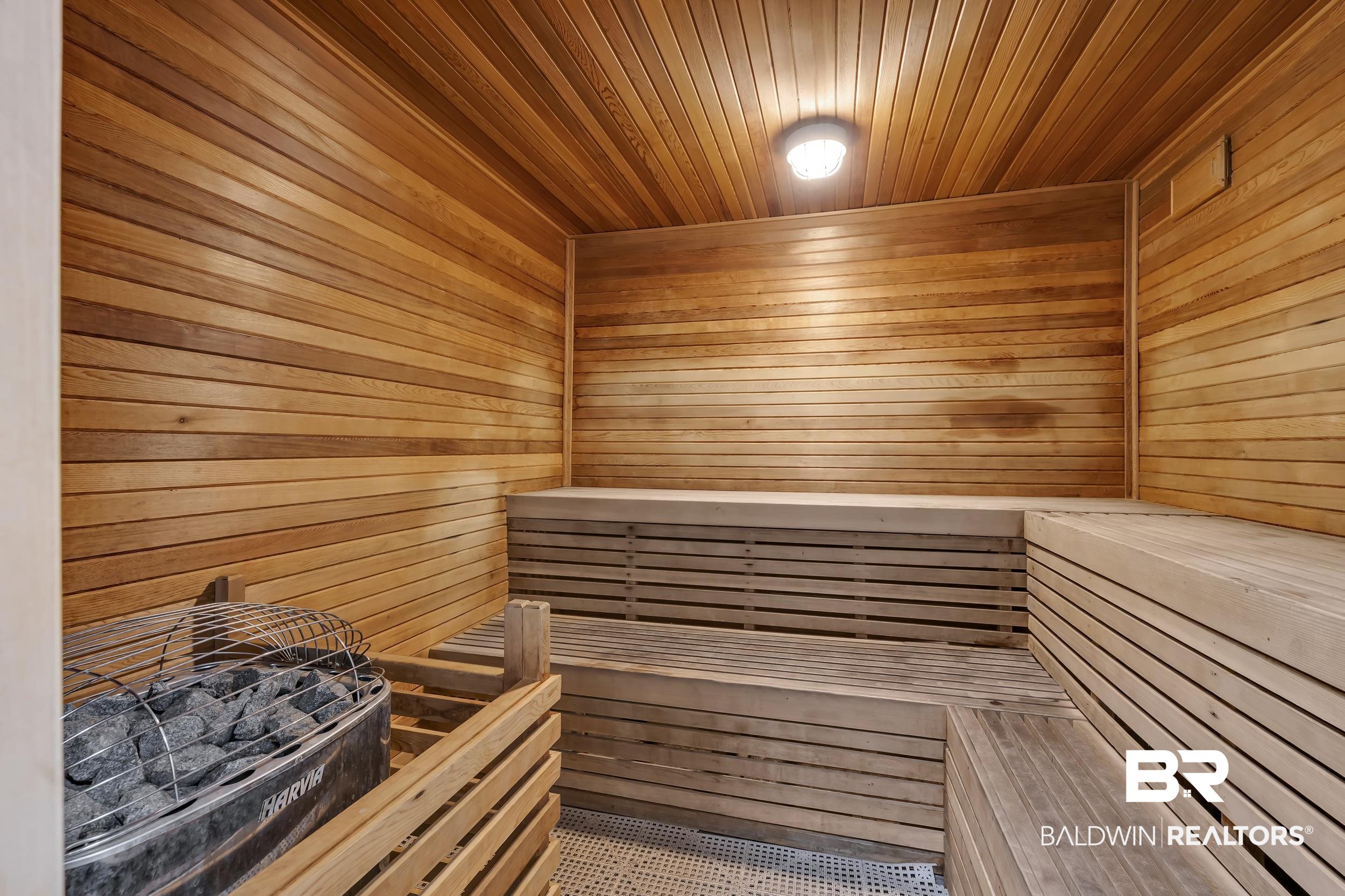 400 Plantation Road, Unit 2118 Gulf Shores, AL 36542 - Photo 34 of 59 Custom sauna featuring horizontal wood paneling, multi-tiered wood bench seating, and a built-in electric heater