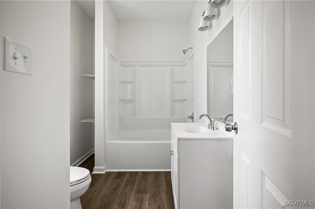 9214 River Road Petersburg, VA 23803 - Photo 8 of 36 Bathroom with wood finished floors, vanity, and sh