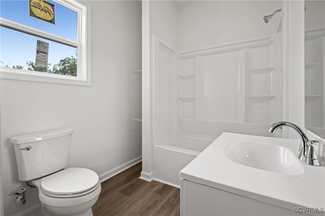 9214 River Road Petersburg, VA 23803 - Photo 10 of 36 Bathroom with wood finished floors, vanity, and tu